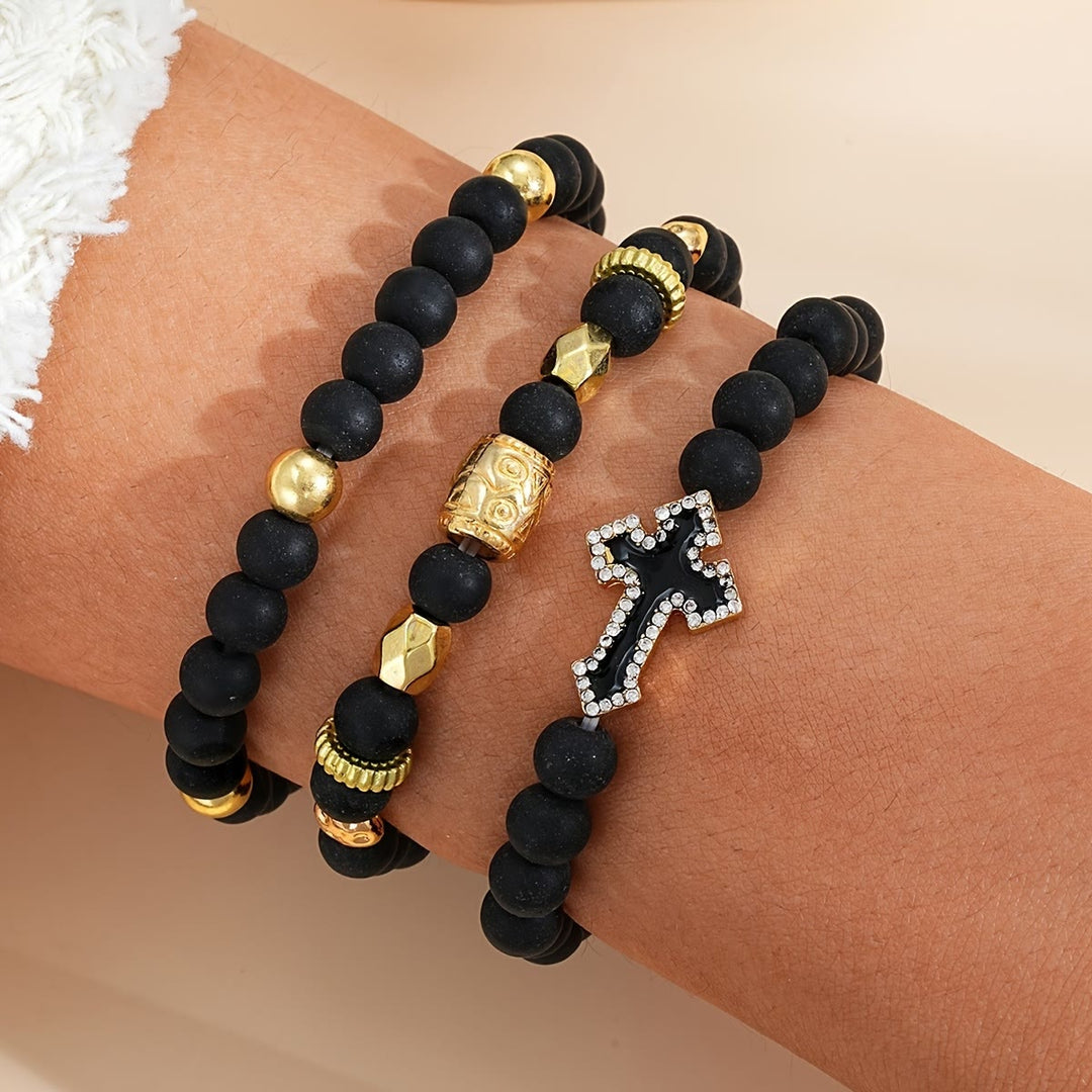 Christianartworkshop Multi-Layer Matte Black Stone Bead Stretch Bracelet with Paved Zircon Cross & Carved Gold Spacers - image 1