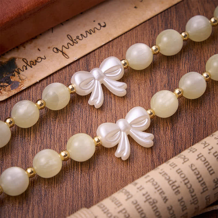 Christianartworkshop Pale Green Cat's Eye Resin Bow Rosary With Gilded Cross: Emblem of Soft Heavenly Grace - image 6